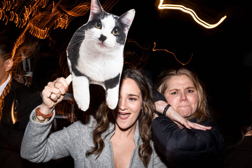 Bridal party holding up photo of cat at Sonoma County CA wedding reception