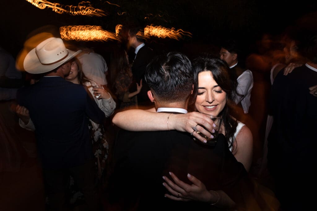 Bride and groom hugging while dancing at Vine Hill House wedding