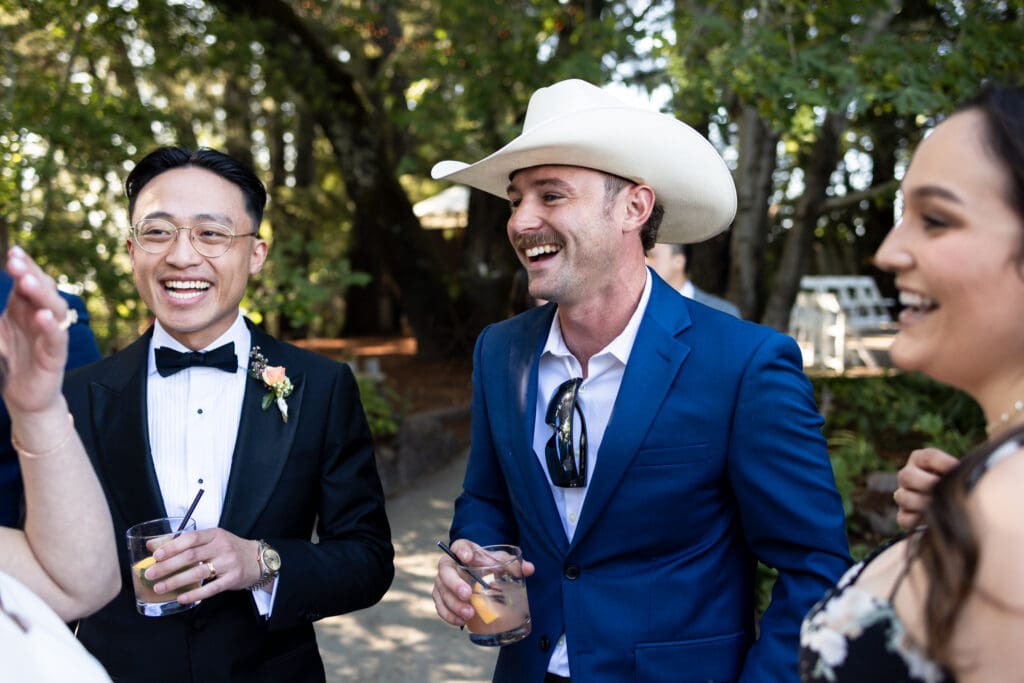 Wedding guests laughing and celebrating before wedding reception at Sonoma County wedding