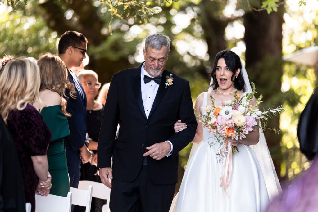Bride being walked down the aisle by her father in Sonoma County wedding