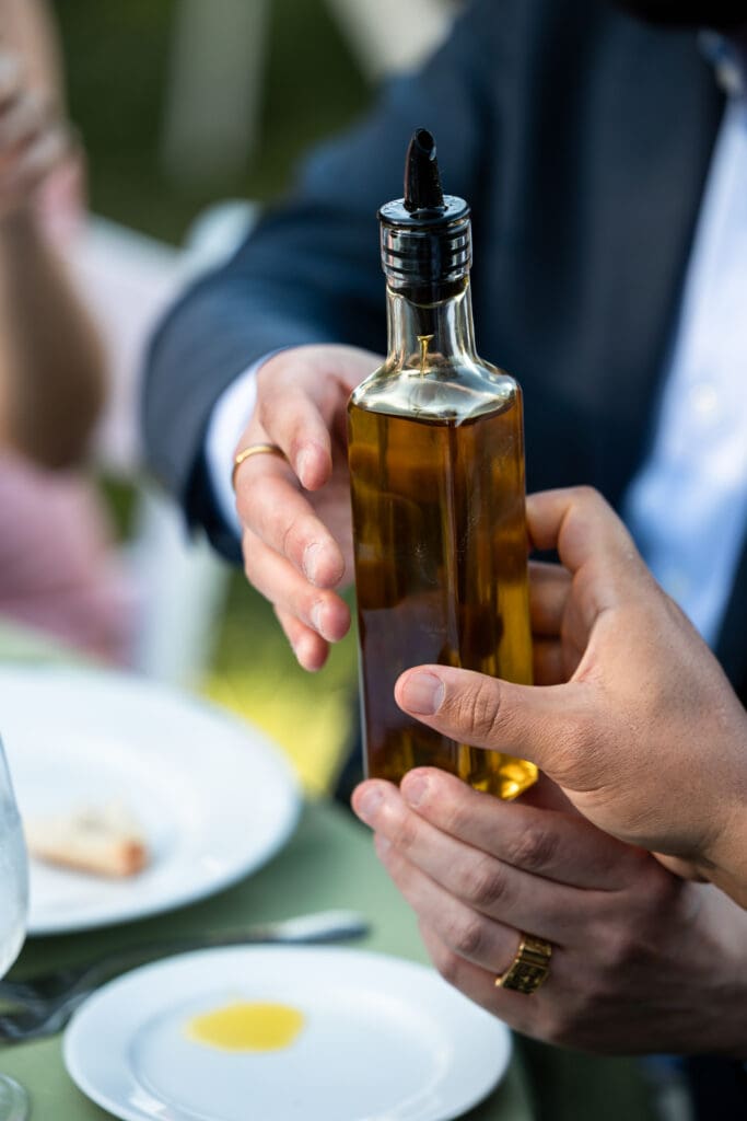 Bottle of olive oil at outdoor Vine Hill House wedding