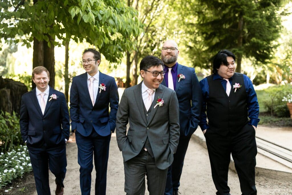 Groomsmen with hands in their pockets at Nestldown wedding