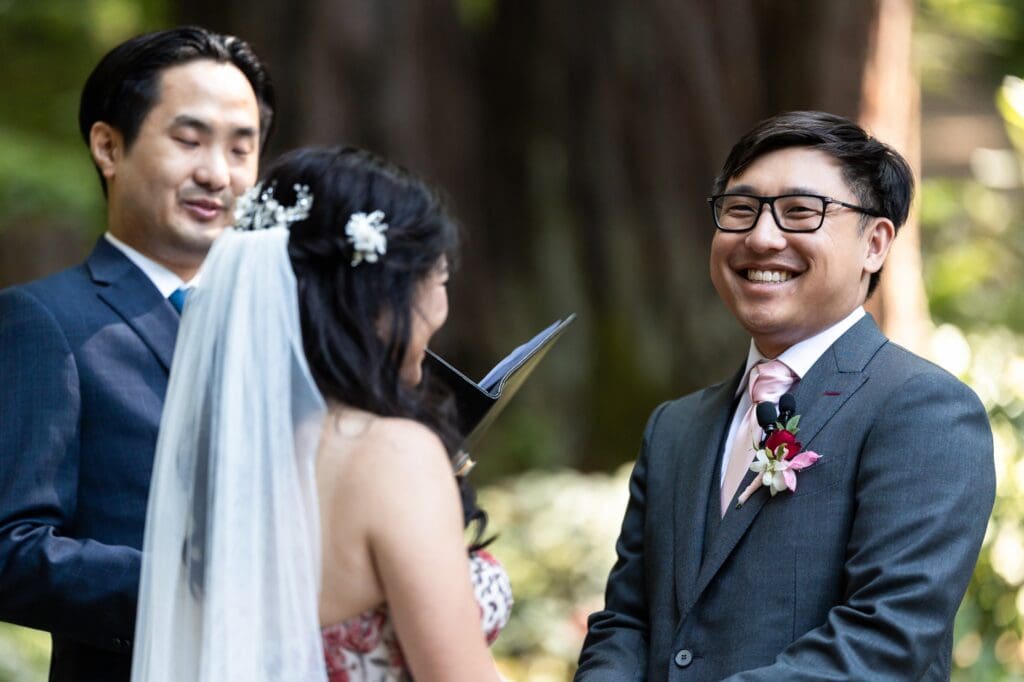 Groom laughing during wedding vows at Nestldown wedding ceremony