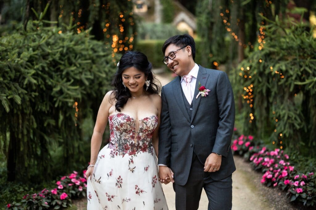 Bride and groom walking hand-in-hand at Nestldown wedding in a close up photo