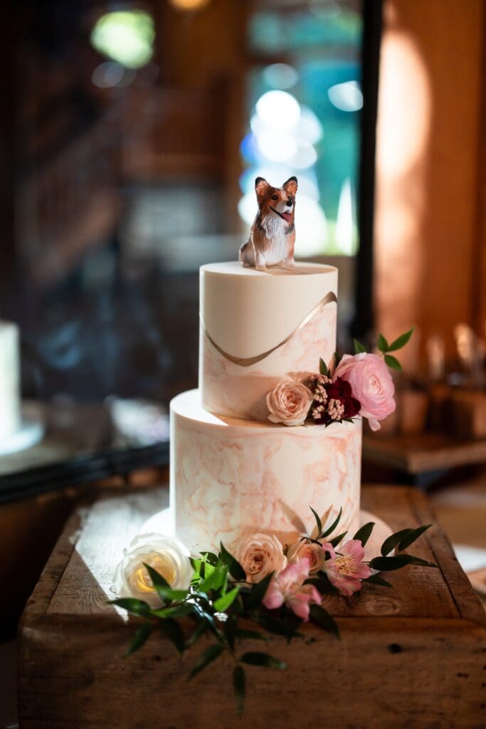 Two tier cake with a corgi cake topper for Nestldown wedding