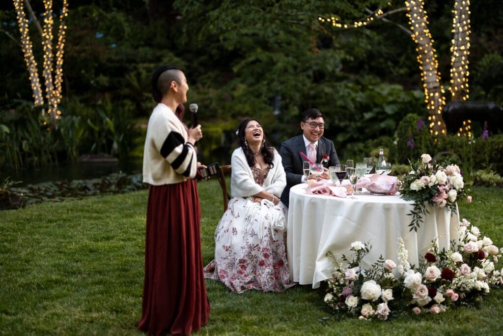 Wedding speech at Nestldown wedding reception with bride laughing