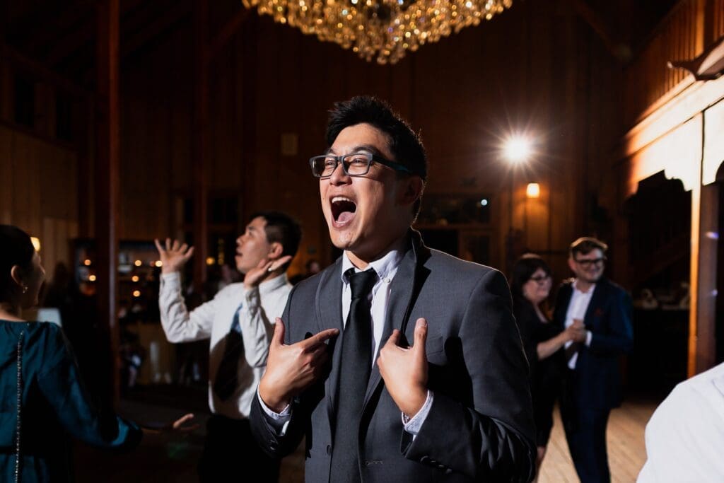 Wedding guest singing at Nestldown wedding reception