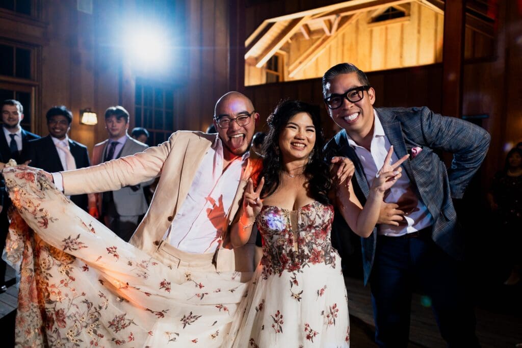 Bride posing with wedding guests at Northern California wedding