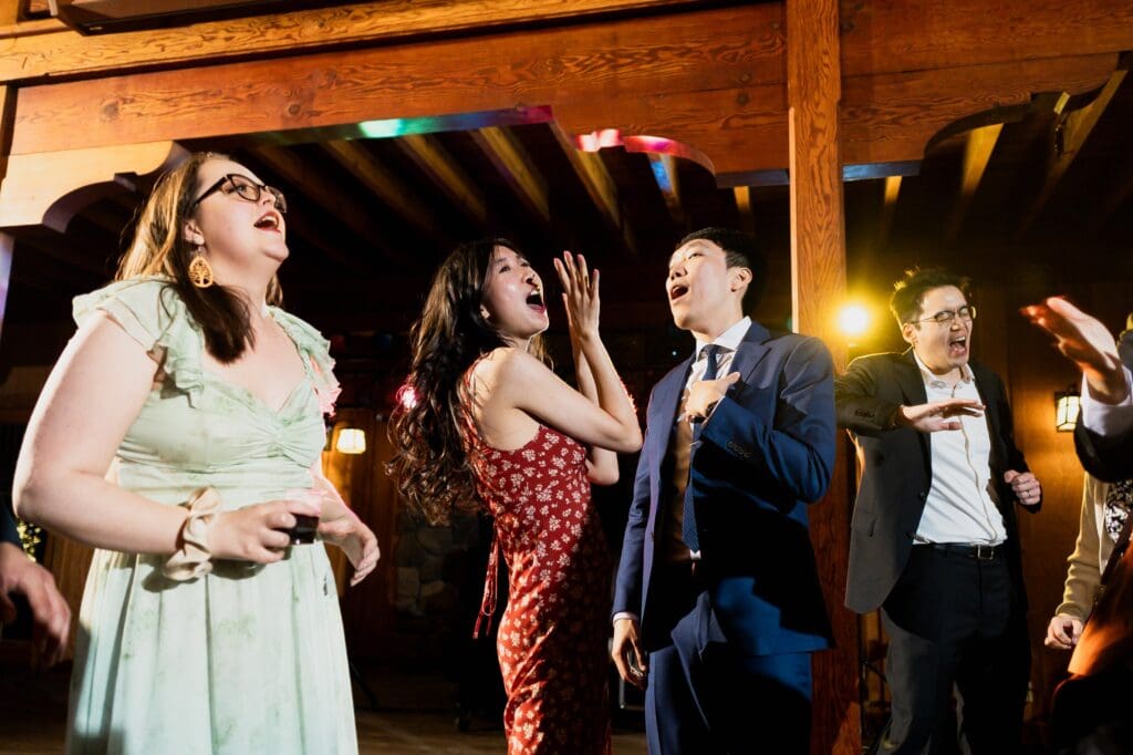 Wedding guests singing at wedding reception in Northern California