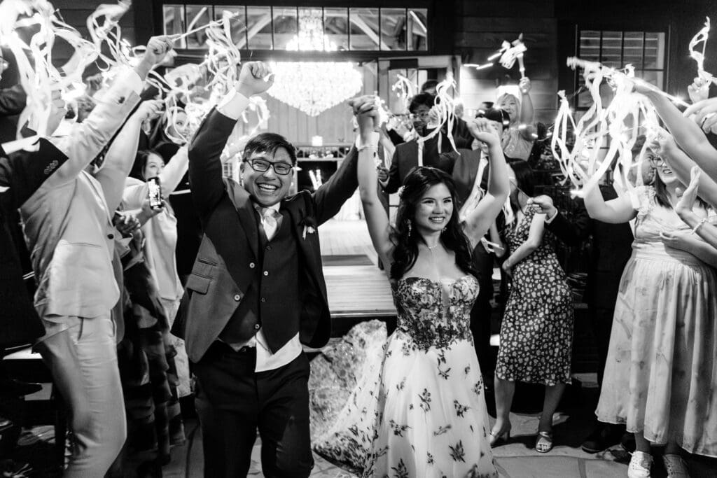Black and white wedding reception exist photo with couple at Nestldown wedding