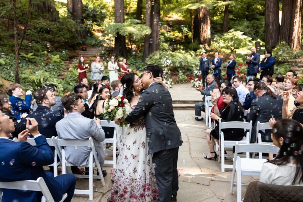 Couple kissing after Nestldown venue wedding ceremony