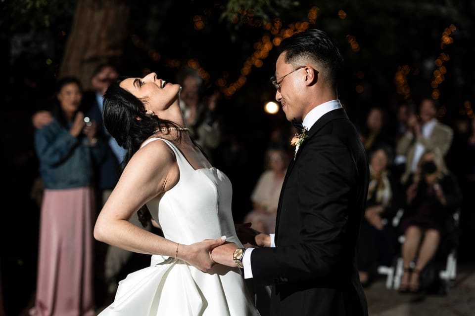 Bride laughing at first dance
