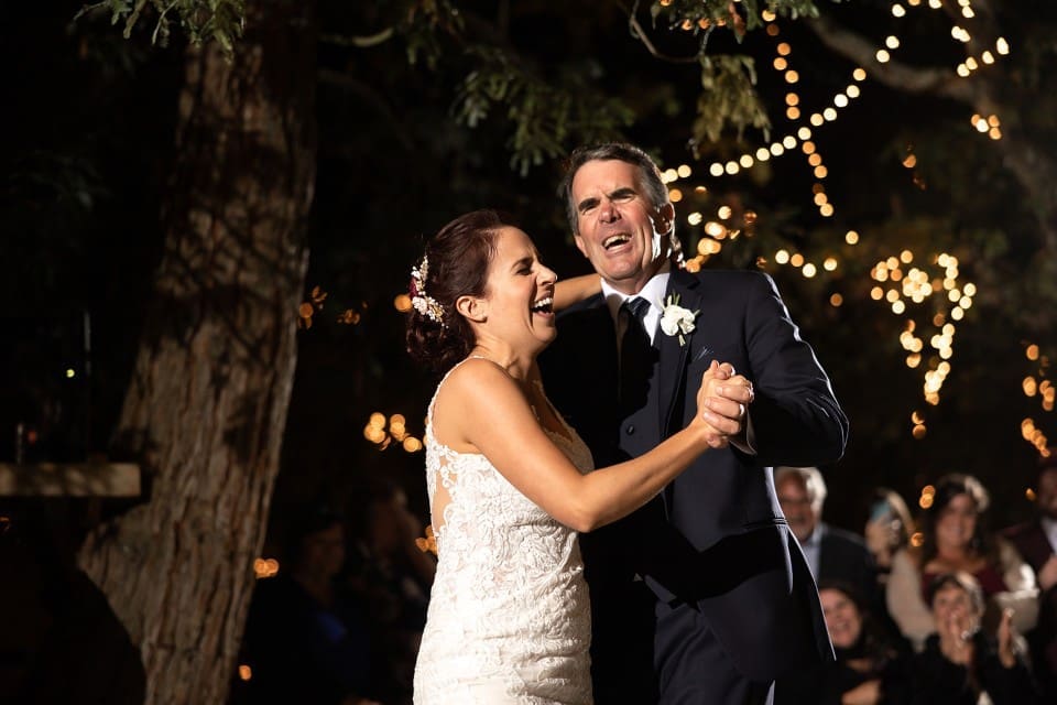 Bride and father laughing during first dance at Northern California wedding