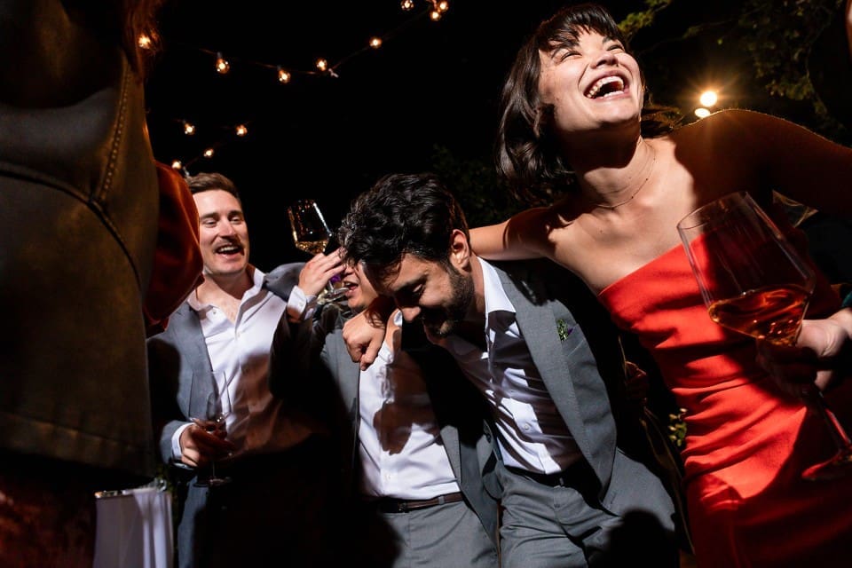 Wedding guests dancing and laughing at Northern California wedding