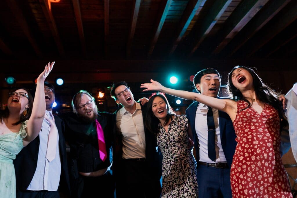 Wedding guests laughing