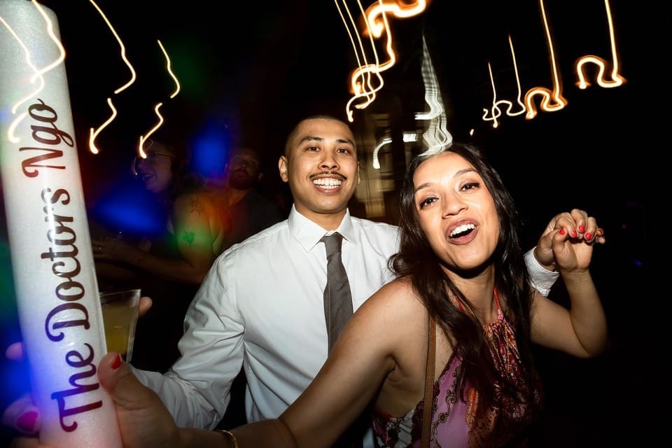 Wedding guests dancing on the dance floor at California wedding reception