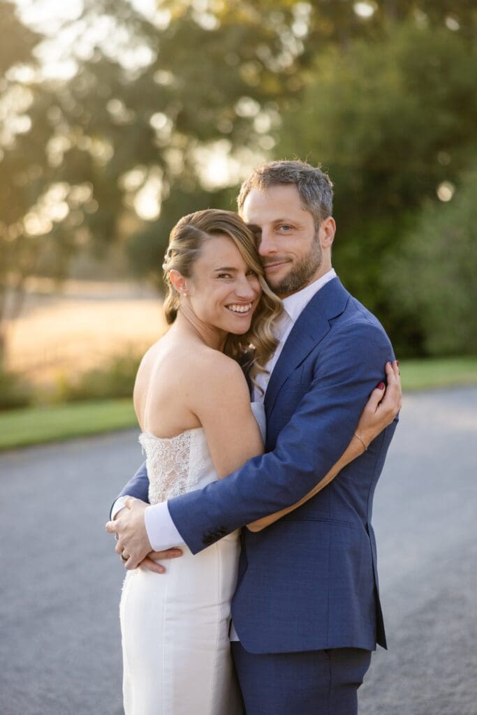 Bride and groom hugging closet up photo at Flying Cloud Farm