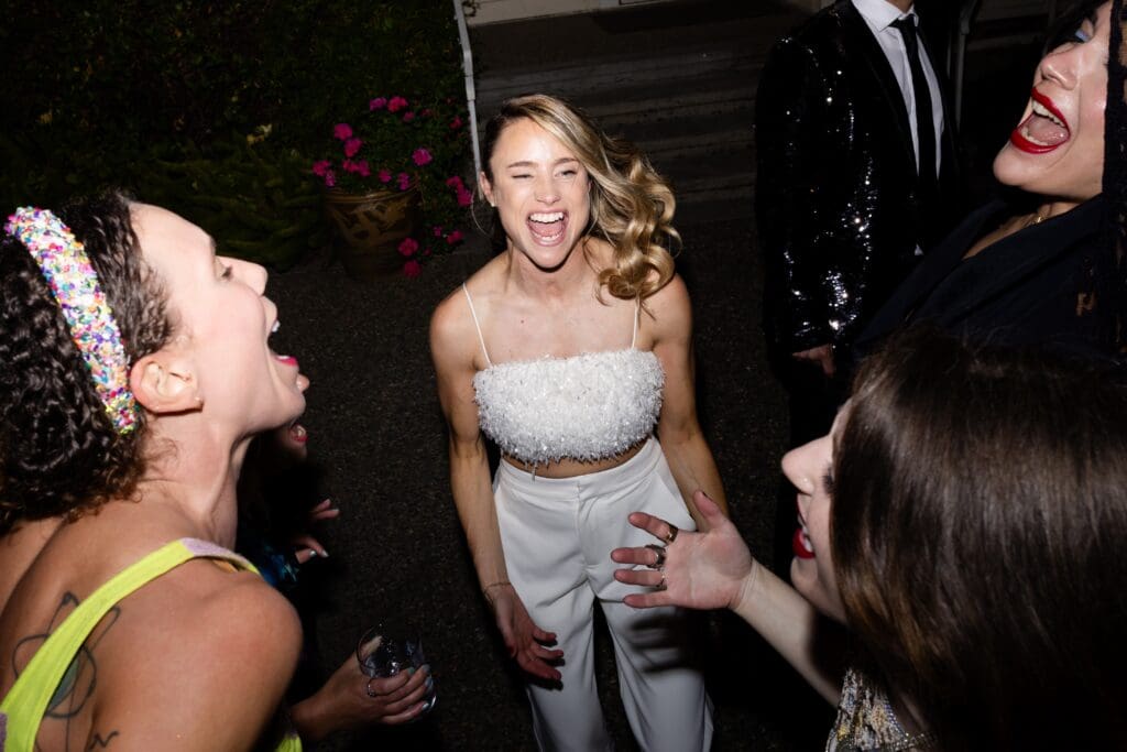 Bride and guests singing on the dance floor in Northern California wedding venue