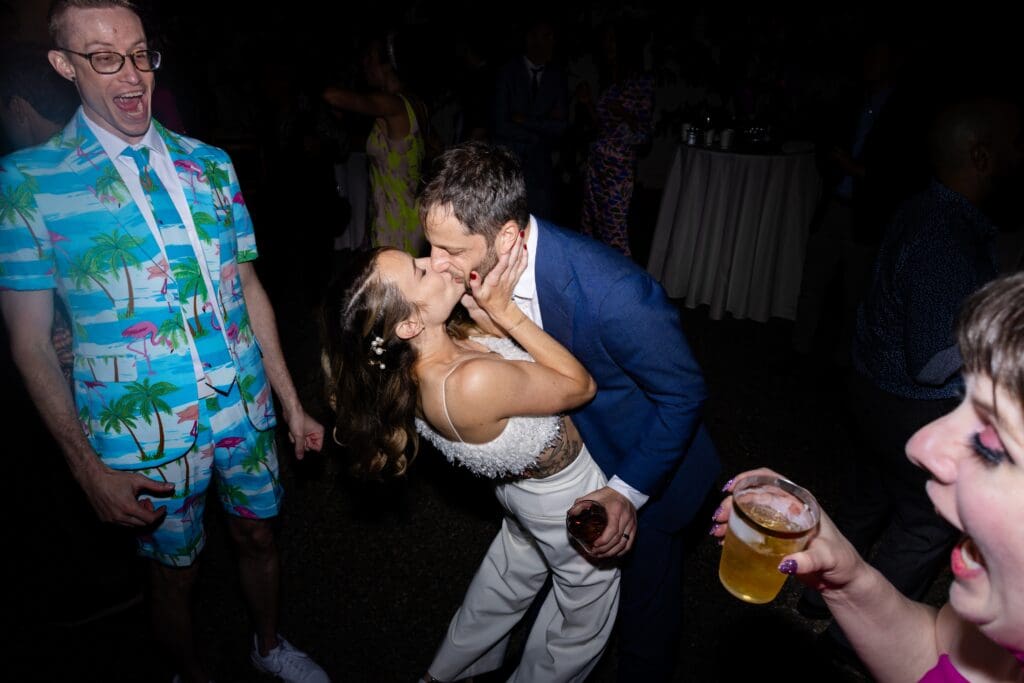 Bride and groom kissing on the dance floor at Flying Cloud Farm