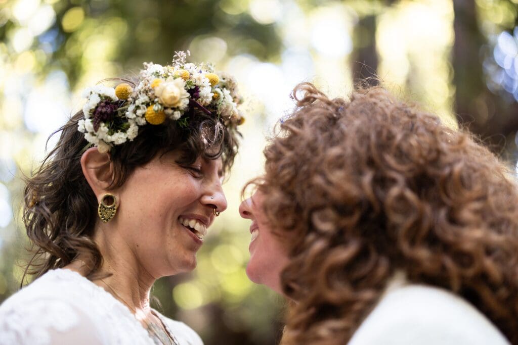 Close up of brides smiling at Gualala Arts Center wedding ceremony