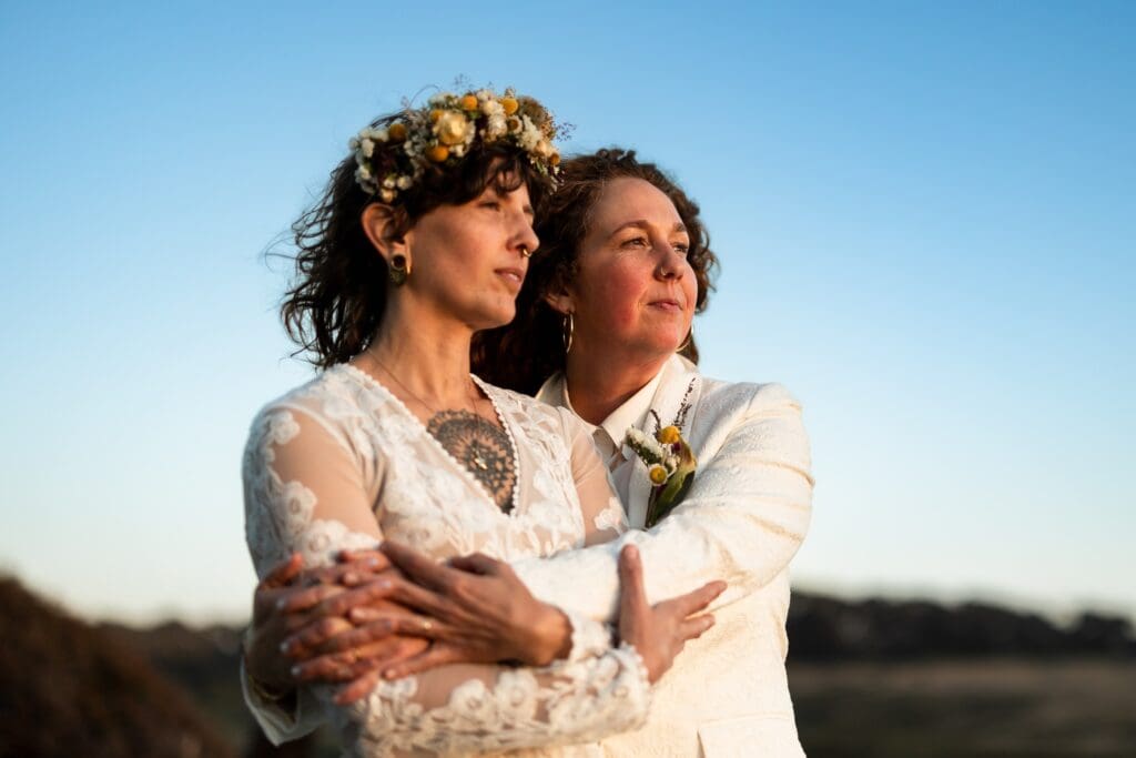 Brides hugging at Gualala Arts Center