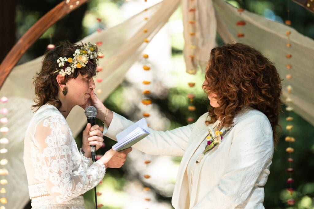 Brides at wedding ceremony for at Gualala Arts Center
