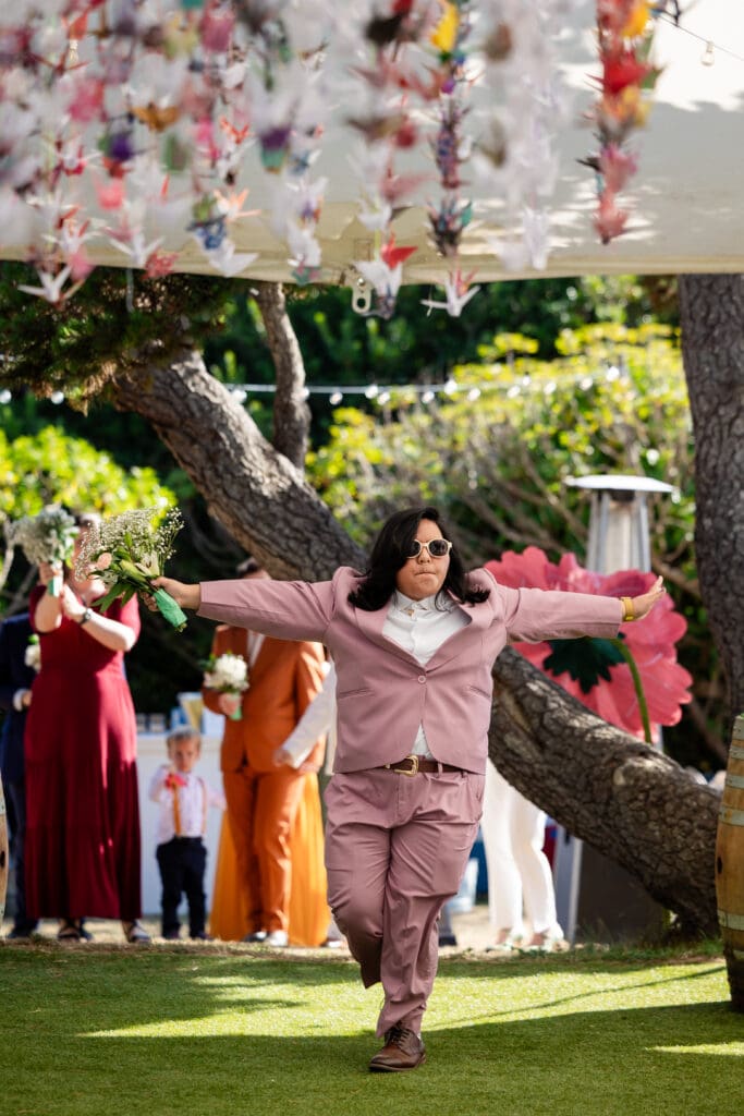 Bridal party with arms out and sunglasses on at Fort Bragg wedding