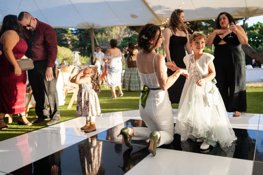 Wedding guests dancing and singing at Holly’s Ocean Meadow in Fort Bragg, CA