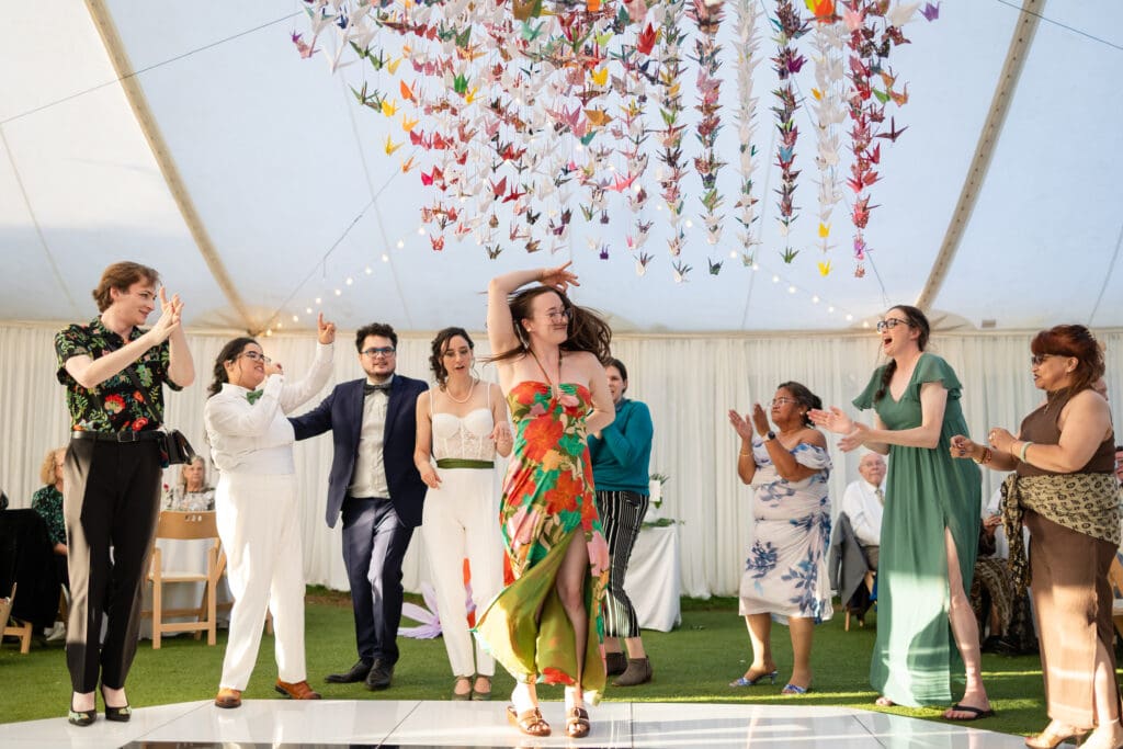 Wedding guest dancing at Holly’s Ocean Meadow in Fort Bragg, CA