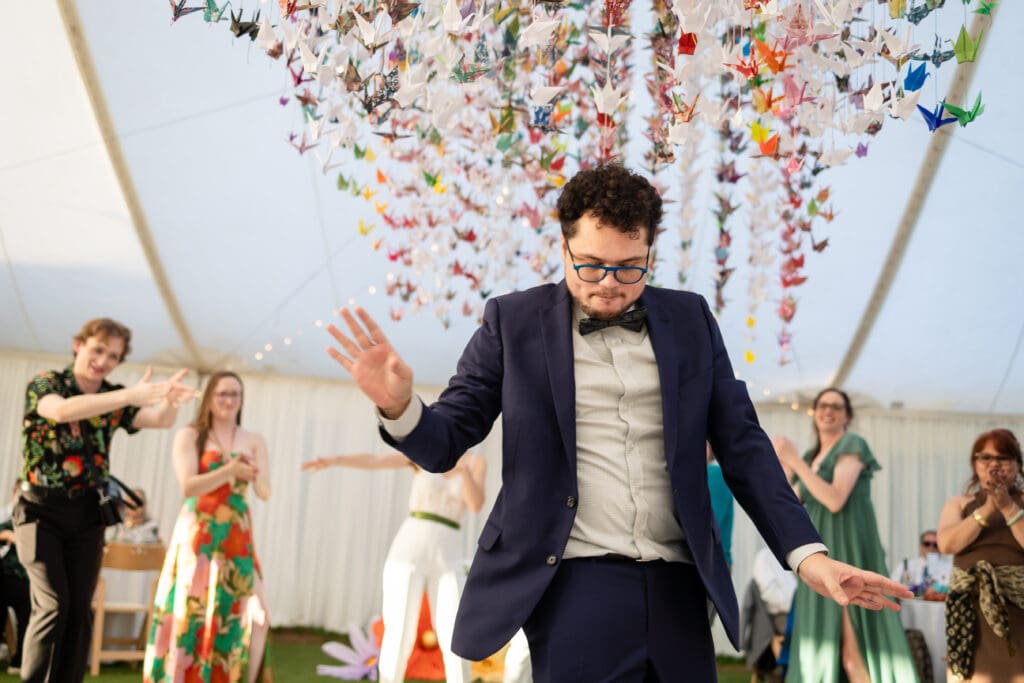 Wedding guest dancing at Holly’s Ocean Meadow in Fort Bragg, CA