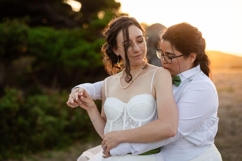 Golden hour portraits with two brides at Holly’s Ocean Meadow in Fort Bragg, CA