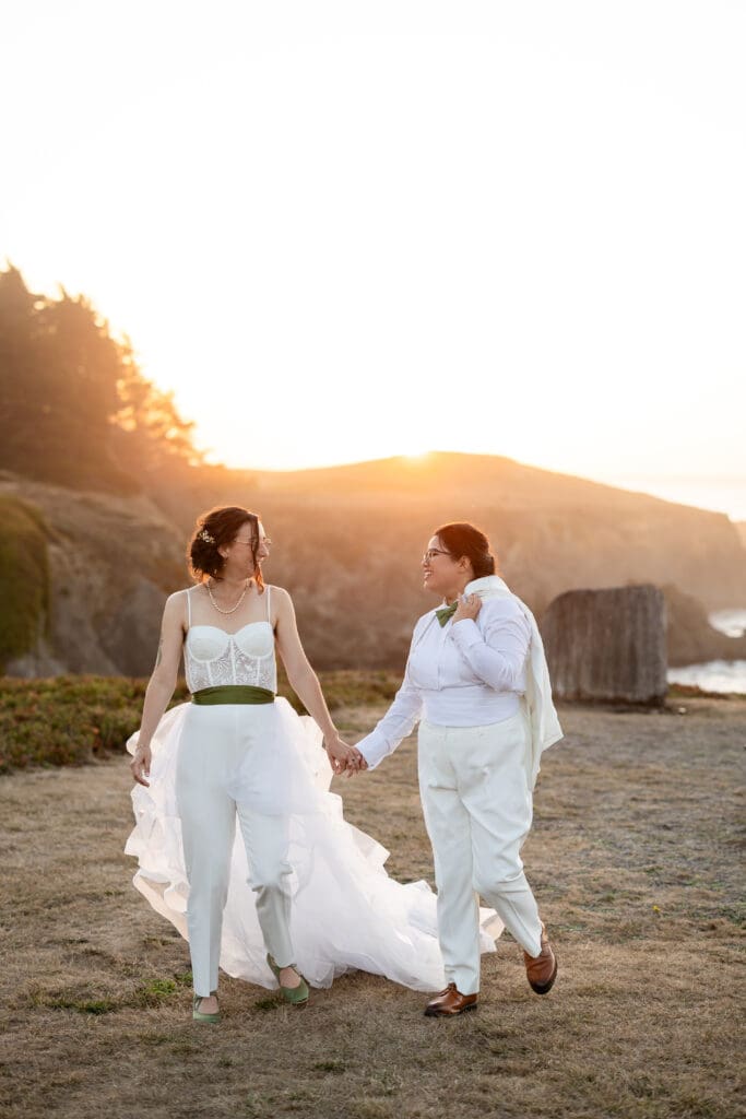 Sunset photo of brides walking for Fort Bragg wedding in California