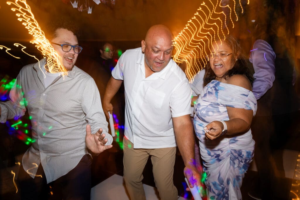 Wedding guests dancing and singing at Holly’s Ocean Meadow wedding in Fort Bragg, CA