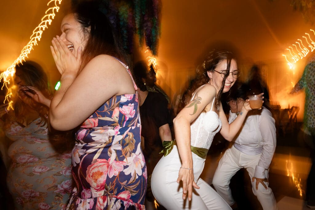 Bride dancing with wedding guests at Fort Bragg wedding in CA