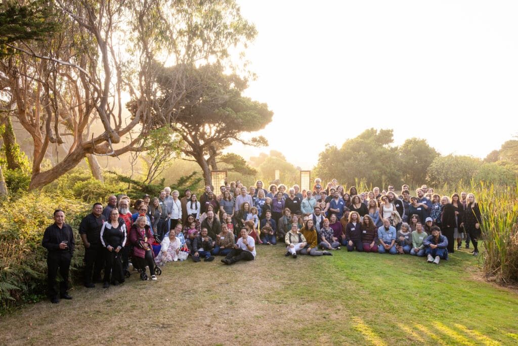 Family all together at Fort Bragg wedding rehearsal dinner at sunset