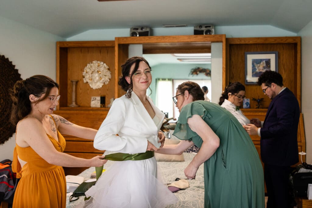 Brides both getting ready at Holly’s Ocean Meadow in Fort Bragg, CA wedding
