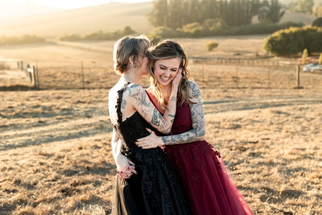 Brides kissing at Olympia's Valley Estate