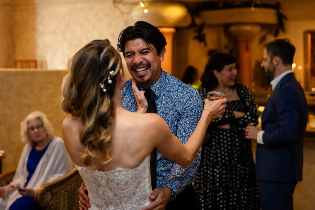 Bride and guest dancing and laughing at Flying Cloud Farm in Petaluma