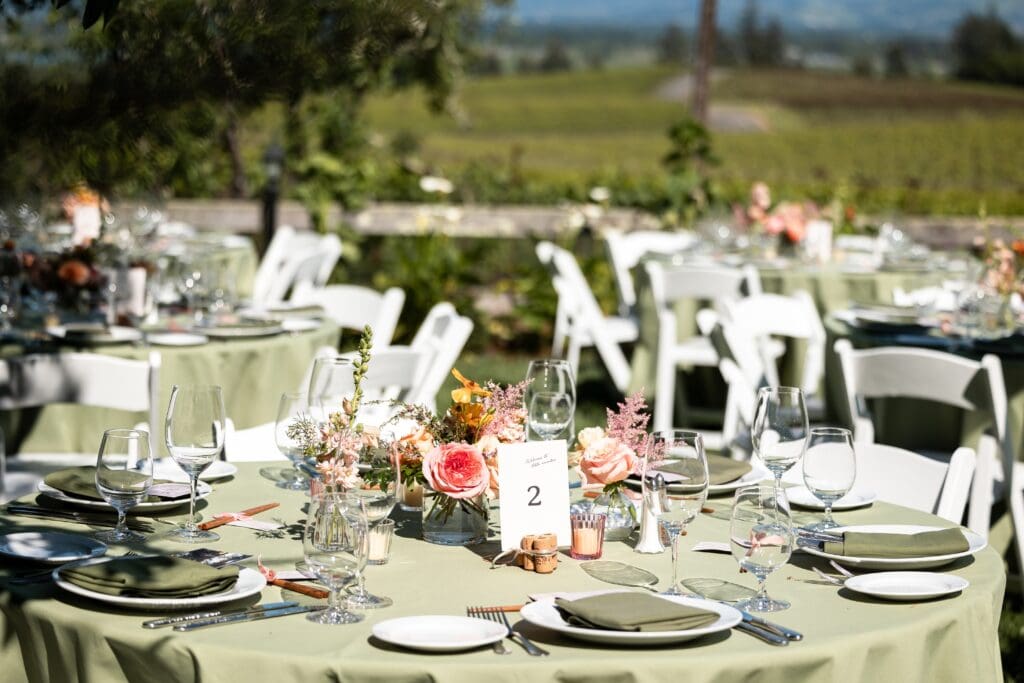 Wedding reception setup with florals and tables and chairs at Vine Hill House in Sonoma County