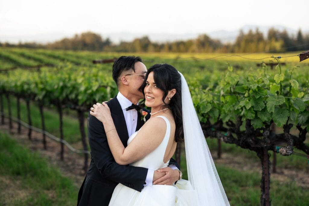 Bride and groom hugging at Vine Hill House wedding venue in Sonoma County