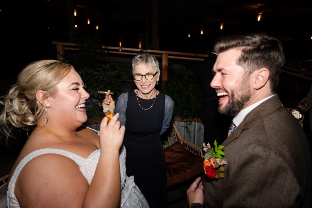 Bride and groom with cigars at The Haven at Tomales Wedding Reception