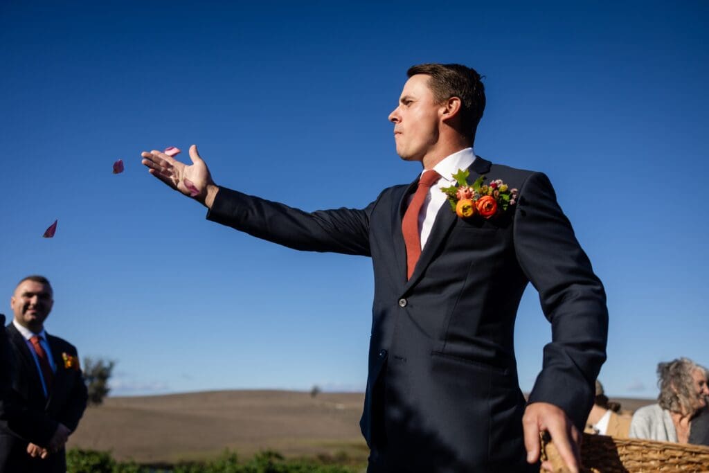 Flower-men tossing petals down the aisle at The Haven at Tomales