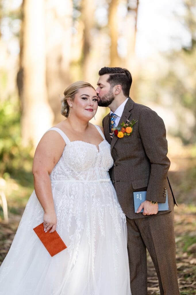 Groom kissing bride's head at The Haven at Tomales