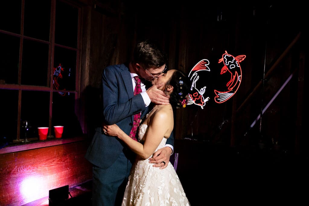 Wedding guests dancing at a Mendocino wedding reception inside the lodge