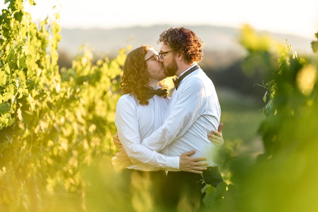 LGBT couple kiss at Gundlach Bundschu Winery Wedding