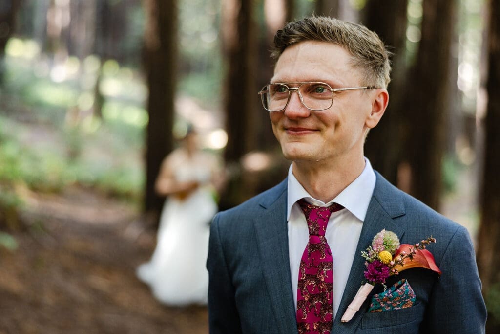 Emotional first look during a Mendocino Woodlands wedding under the redwoods