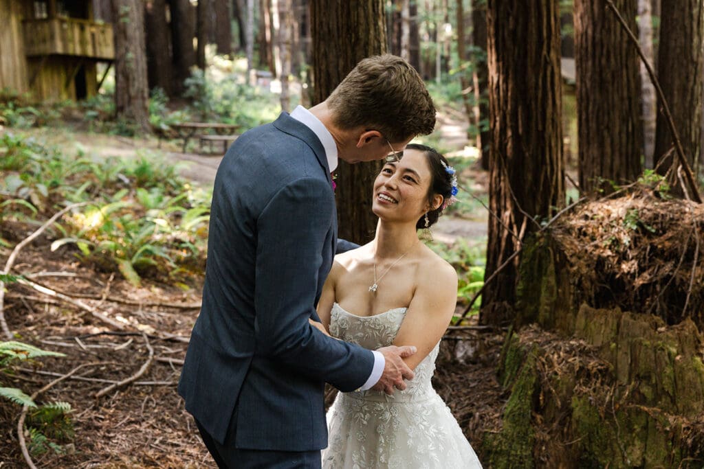 Emotional first look during a Mendocino Woodlands wedding under the redwoods