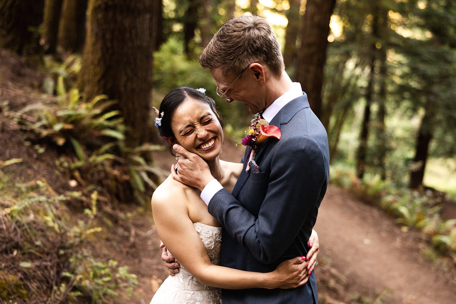 Mendocino Woodlands wedding couple laughs under a canopy of redwoods