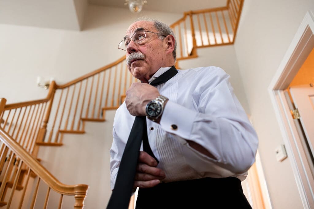father of the bride getting ready at home for an intimate petaluma wedding.