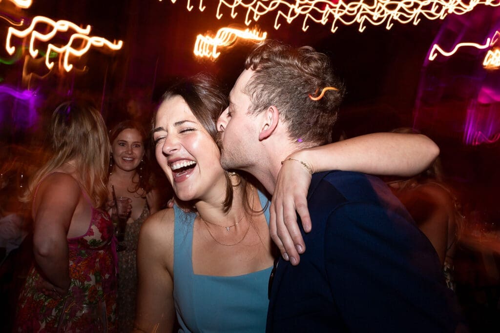 Guests dancing at barn reception at Olympias Valley Estate wedding